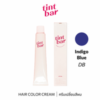 b-ex Tintbar Indigo Blue hair color cream in 90g tube, showcasing vibrant blue hair dye in a professional application setting.